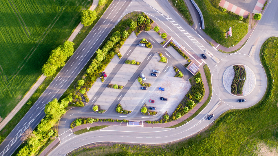 Green car park with lots of free spaces